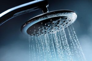 A showerhead spraying hot water in Springfield, Illinois