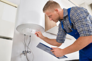 A professional technician skillfully examines a water heater in a Springfield, IL home.